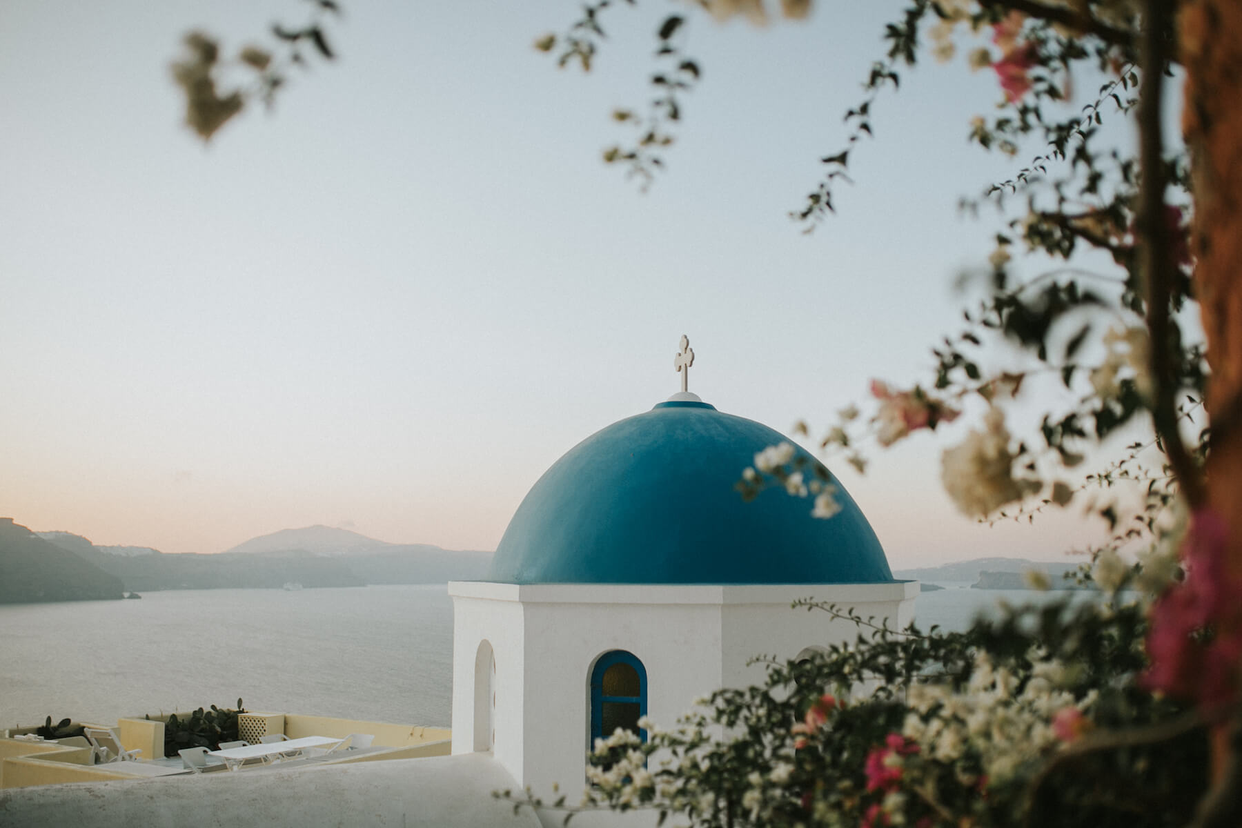 blue-domed church in Santorini, Greece