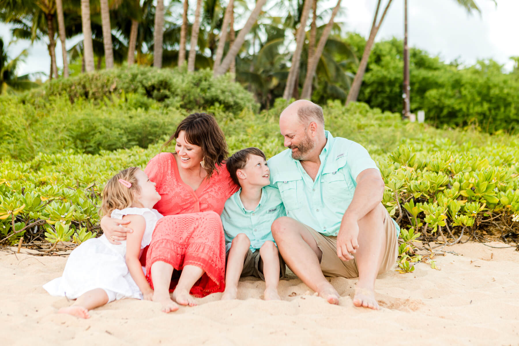 Family on the beach in Kauai Hawaii USA