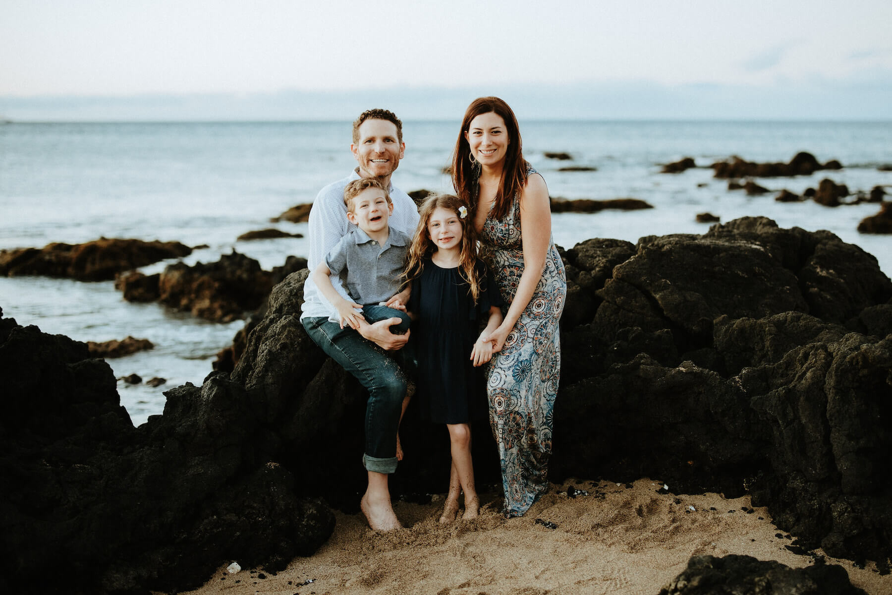 Family on the beach in Kona Hawaii USA