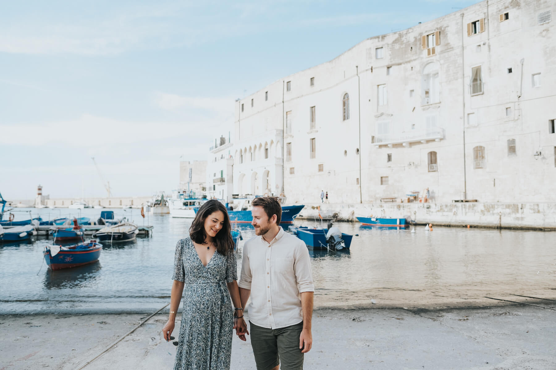 A couple dances together in Bari, Italy on a babymoon photoshoot with Flytographer.