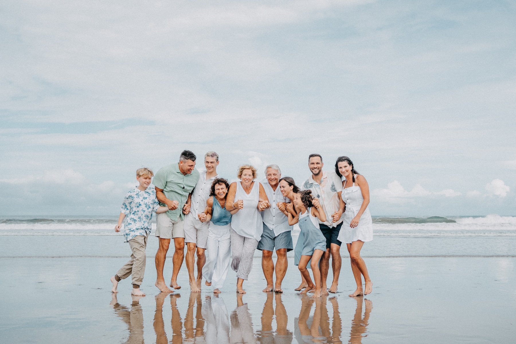 A family reunion hug on the beach in Guanacaste, Costa Rica